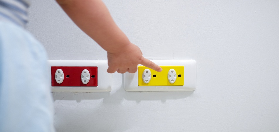 Asian toddler baby boy child play with electric plug.